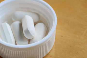 Closeup of some white pills