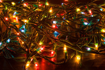 Tangled Christmas lights on a table