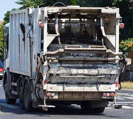 Naklejka premium Garbage truck on the street