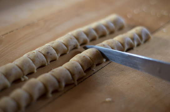 Unbake raw dough knife cut even piece row cookies buns making baking preparation