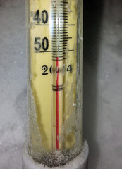 The scale of the thermometer with a strong frost