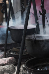 hot cast iron pot with soup