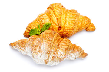 two fresh croissants on white background