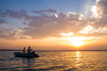 Grandfather and granddaughter fishing