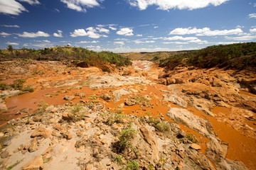 wide river bed Betsiboka, flushes red soil after heavy rains in Madagascar