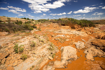 wide river bed Betsiboka, flushes red soil after heavy rains in Madagascar