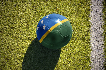 football ball with the national flag of Solomon Islands lies on the field