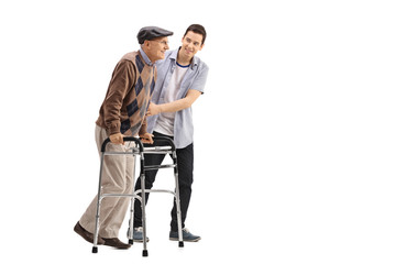 Young man helping an elderly man with a walker