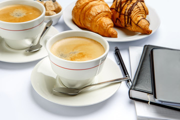 business lunch - fresh croissants and coffee