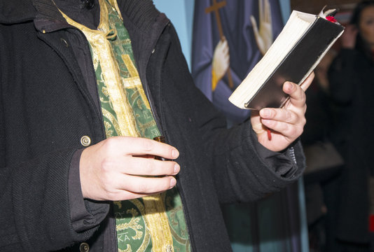 Prayer book in hands of the priest. Orthodox Christian Church