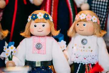 Obraz na płótnie Canvas Souvenirs Ethnic Folk National Wooden Dolls Toys At European Estonia