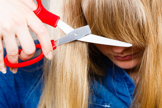 Woman Cutting Her Fringe.