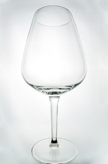 Crystal wine glass on a gray background, art object, remove the lens, 