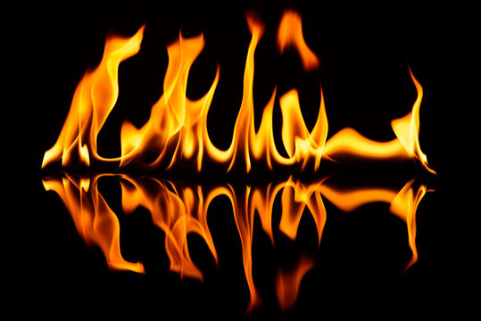 The fire on black glass with a reflection