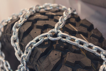 New tires with chains close up. Transport