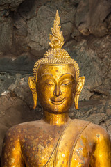 Fototapeta premium Buddha in the cave , deep to the cave in Thailand