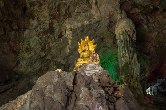 Buddha in the cave , deep to the cave in Thailand