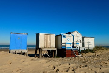 Obraz na płótnie Canvas CABINS ON THE BEACH OF CALAIS IN WINTER , PAS DE CALAIS, FRANCE