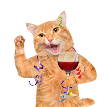 Cat is holding a glass of wine and celebrating. Isolated on white background.