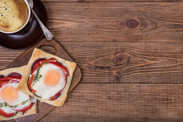 Red pepper and baked egg galettes and cup of coffee.
