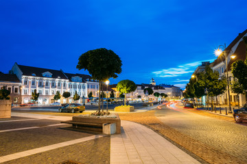 Vilnius Lithuania. Evening View Of Illuminated Didzioji Street With Red Motion Blur Effect On Road