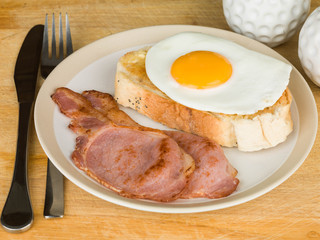 Cooked Breakfast of Bacon and Egg on Toast