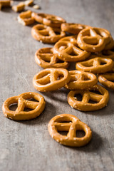 Salted pretzels on wooden background