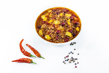 mexican chilly with meat and black beans in a white bowl