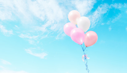Fototapeta na wymiar Colorful balloons flying on sky.