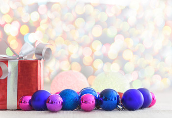 Decorative red gift box with a large silver bow and background b