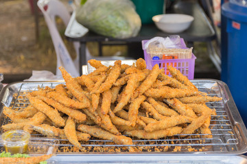 fried fish fillets and vegetable salad