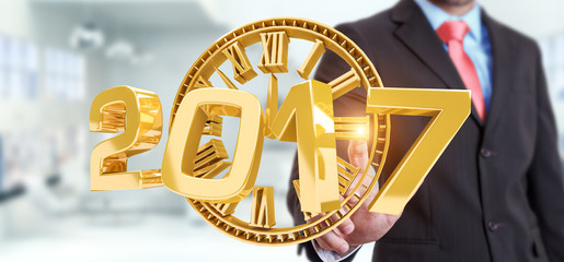 Businessman holding 2017 3D rendering text with his finger