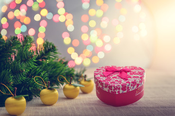 Decorative red gift box with a large silver bow and background b