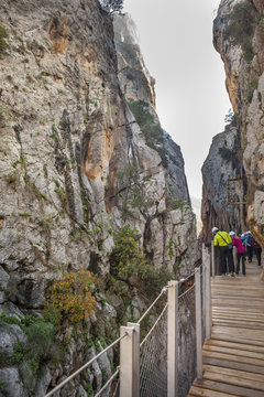 Visitors walking along the footbridge of Caminito del Rey path