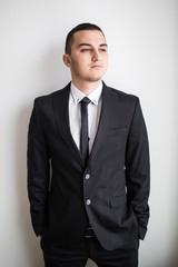 Business man in suit over white background