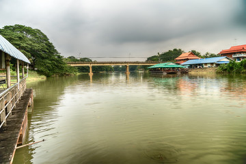 Fototapeta na wymiar Road bridge across the lake in forests