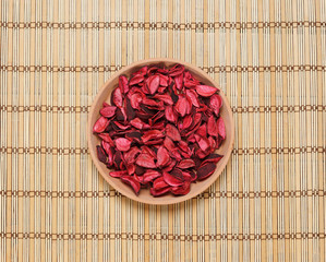 Plate with aroma petals on a bamboo mat