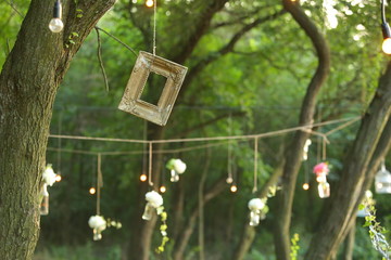 Forest decoration with flowers and wooden frame 