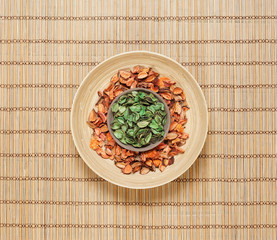 Plate with aroma petals on a bamboo mat