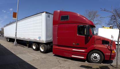 Fototapeta premium Red and white semi truck and trailer.
