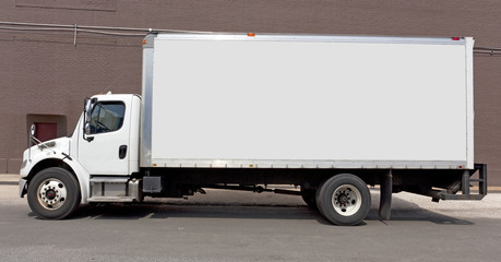Parked white delivery truck with copy space. Horizontal.