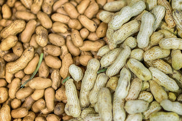 Peanuts in shell texture background. Raw peanuts on display at a