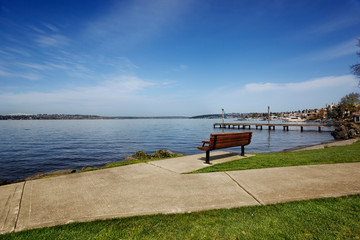 Bench in Marsh Park facing towards Kirkland at a lakeside park on Lake Washington