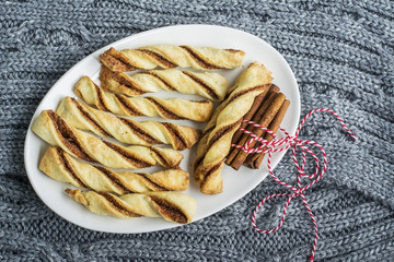 Cozy flavorful baked crispy sticks with cinnamon for tea, snacks, picnic, as a gift   holiday. Top view. comfort food concept