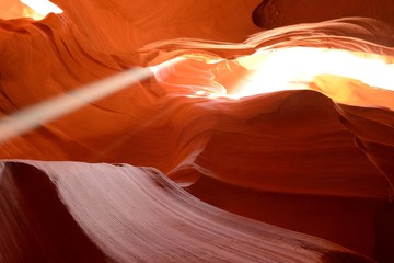Canyon Sunlight  - Midday sun shines in a colorful sandstone slot canyon.