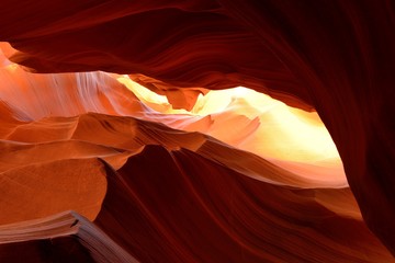 Burning Rock - Summer sun lights up the colorful sandstone rocks in a high desert slot canyon