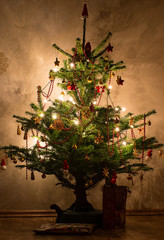 The decorated Christmas tree with stars and Christmas glitter balls