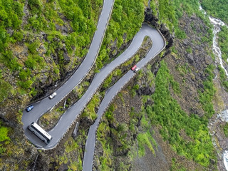 Overhead view of coach going round hairpin bend on narrow Trollstigen mountain road in Norway