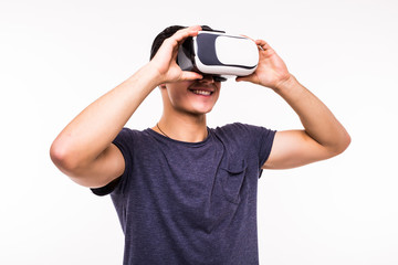 portrait of young excited man experiencing virtual reality isolated on white background