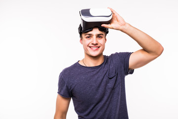 portrait of young excited man experiencing virtual reality isolated on white background